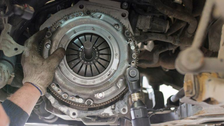 Mechanic fitting replacement clutch
